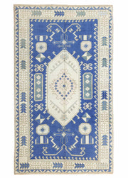 Buget İlkel Desenli El Dokuma Mavi Yün Halı 139x238 cm